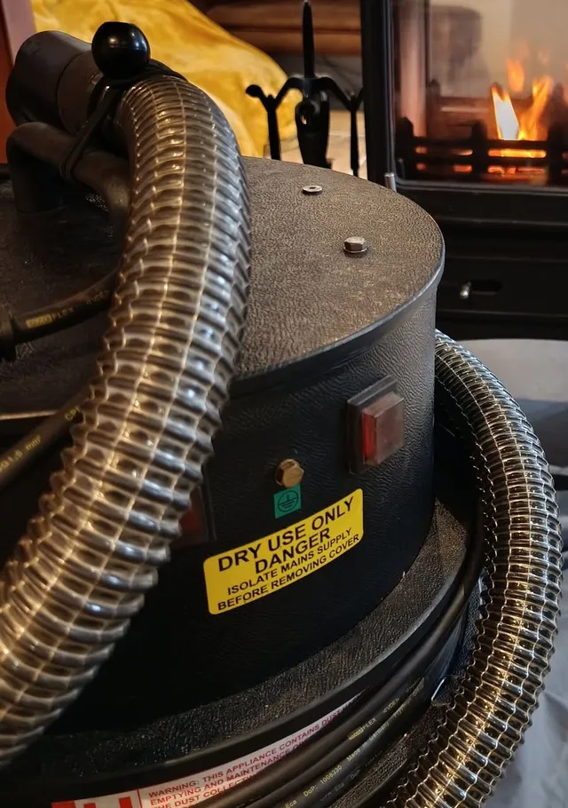 Jack's vacuum and hose on dust sheets
